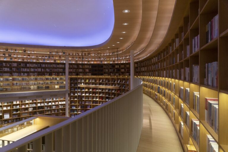 a circular library with books on shelves