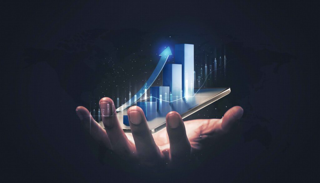 a hand holding a phone with a graph on it