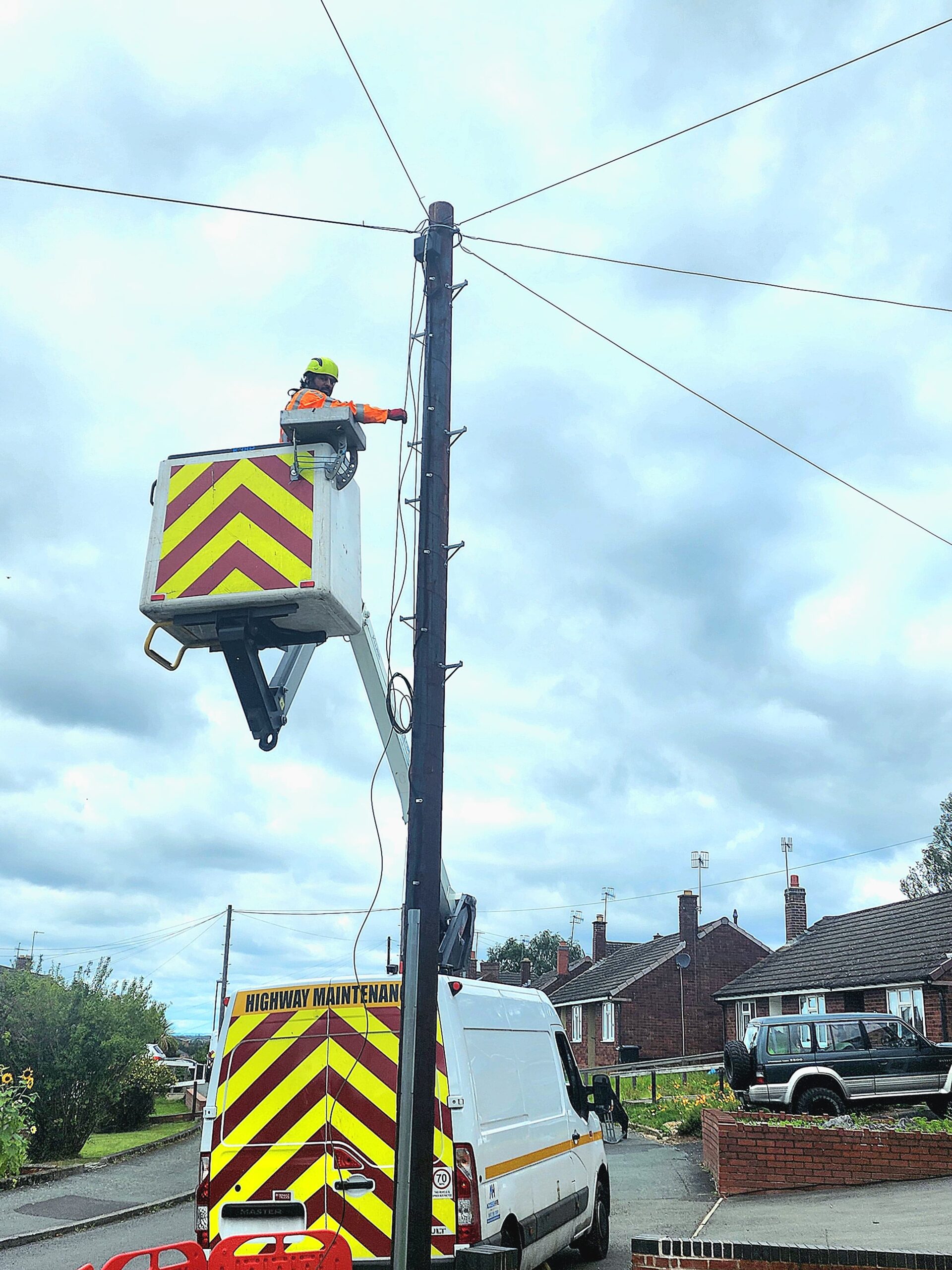 a man working on a power pole